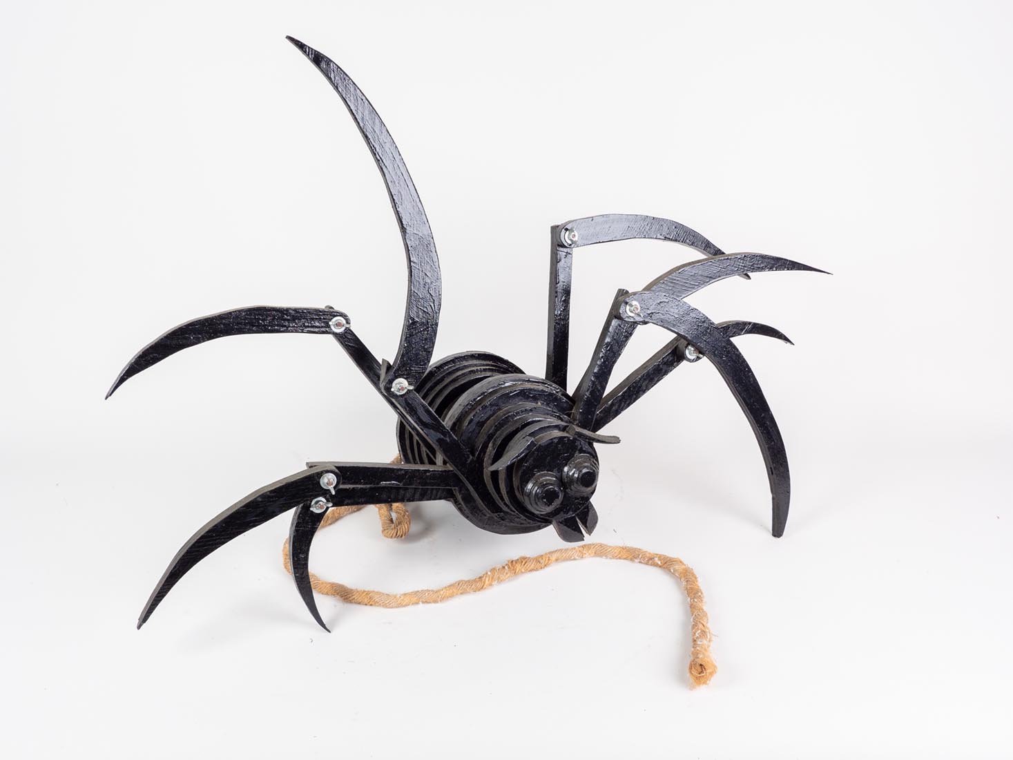 wooden spider sculpture by Marjorie White Williams